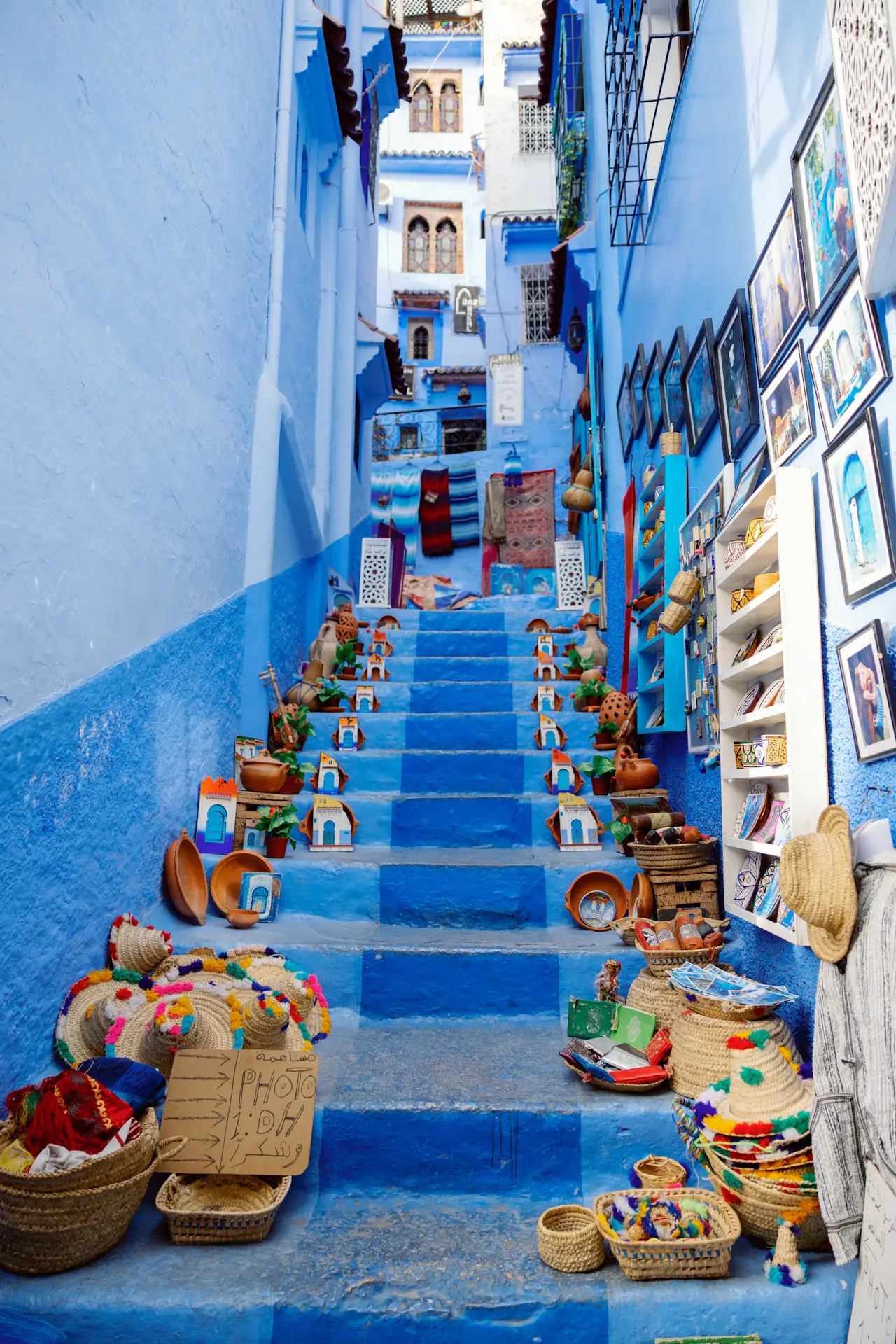Blue staircase and woven baskets in Chefchaouen